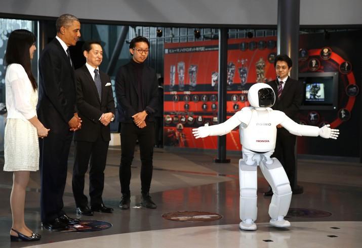 U.S. President Barack Obama is introduced to "Asimo" the robot while visiting Miraikan in Tokyo