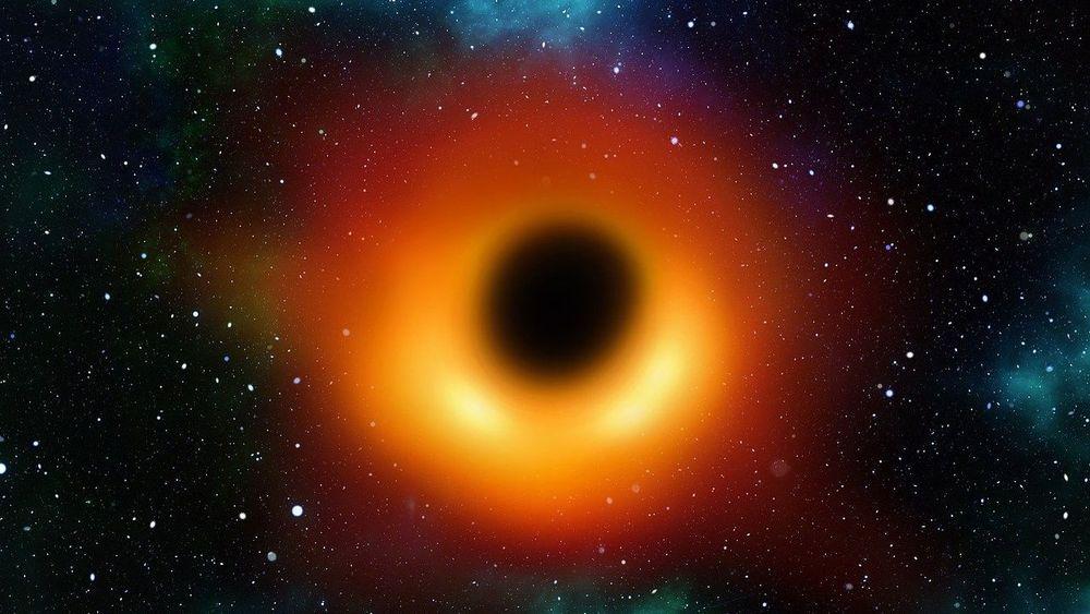 Representación de un agujero negro con luz roja y amarilla