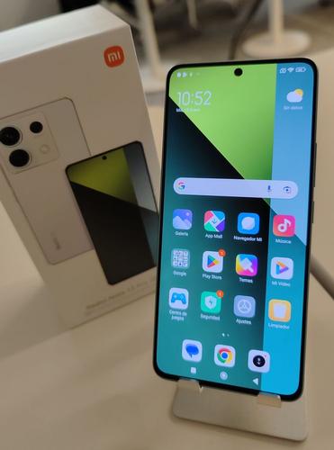 A unit of the Xiaomi Redmi Note 13 Pro 5G with the box next to it