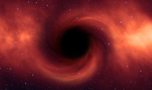 Un agujero negro con materia oscura y color rojo