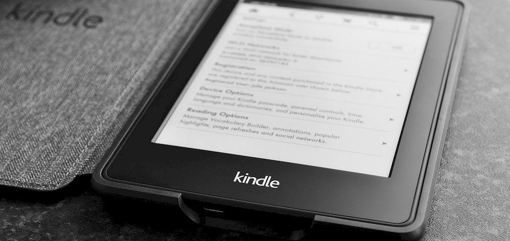 A Kindle with the case open on the table