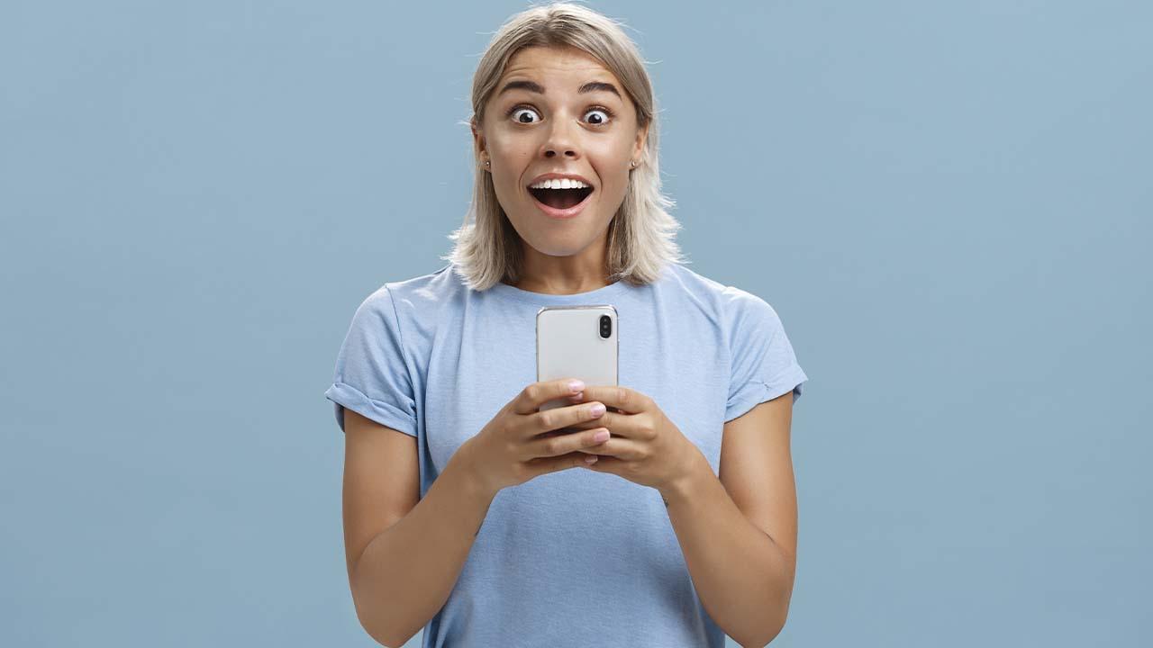 surprised girl looking at mobile