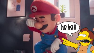 Mario sentado muy triste y Nelson se ríe de él