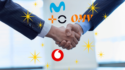Dos ejecutivos firmando un acuerdo entre operadoras y OMV