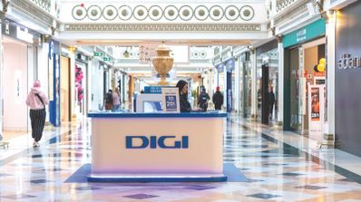 Fachada de una tienda física de Digi en España, con el logotipo rojo de la compañía visible en la entrada