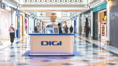 Fachada de una tienda física de la operadora Digi en una calle de España, representando a la compañía cuyos clientes reportan fallos de roaming
