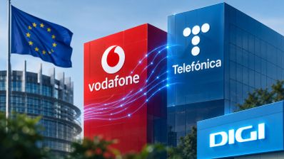 Logotipos de Vodafone, Telefónica y Digi sobre edificios de oficinas junto a la bandera de la Unión Europea.
