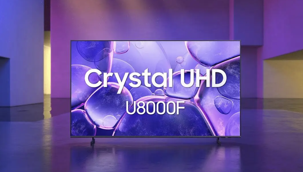 Televisor Samsung Crystal UHD modelo U8000F mostrando un fondo de pantalla con burbujas púrpuras en un entorno minimalista.